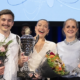 Vinner av Forsker Grand Prix, flankert av andre og tredjeplass.